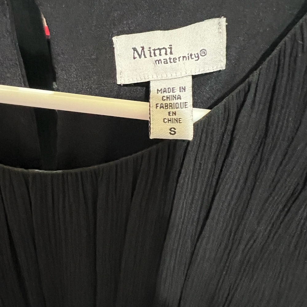 Black knew length maternity dress. Great for a wedding or black tie event.